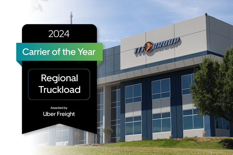 ITF Group headquarters with Uber Freight’s 2024 Carrier of the Year badge for Regional Truckload displayed in the foreground.